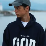 Sudadera azul con capucha para hombre y mujer. Algodón 100%. Con el mensaje “All you need is God”. Producto solidario de Have a God Time